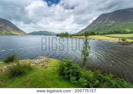 A landscape view of Crummock Water one of the lakes in the Lake District Cumbria United Kingdom.