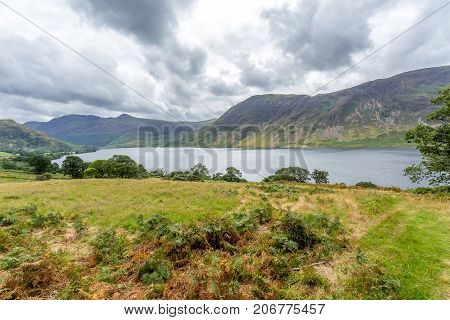 A landscape view of Crummock Water one of the lakes in the Lake District Cumbria United Kingdom.