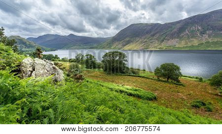 A landscape view of Crummock Water one of the lakes in the Lake District Cumbria United Kingdom.