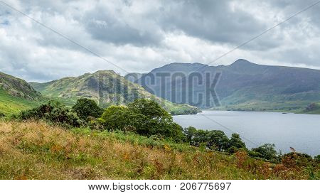 A landscape view of Crummock Water one of the lakes in the Lake District Cumbria United Kingdom.