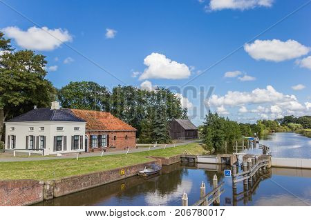 Old house at the Winsumerdiep river in Groningen Netherlands