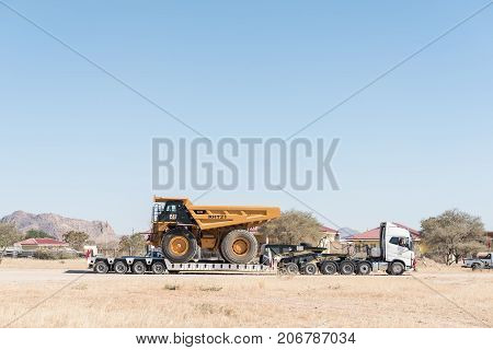 KARIBIB NAMIBIA - JULY 3 2017: A tipper truck being transported on another truck to a mine in Namibia