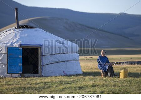 huvsgul Mongolia September 6th 2017: mongolian woman resting outside her ger