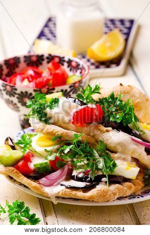 pita sabich sandwich with hummus and vegetables..selective focus