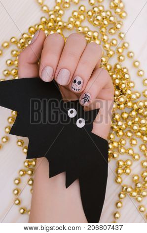 Halloween Nail art design. Light beige nail polish.