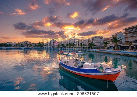 The pictursque port of Sitia, Crete, Greece at sunset. Sitia is a traditional town at the east Crete near the beach of palm trees, Vai.