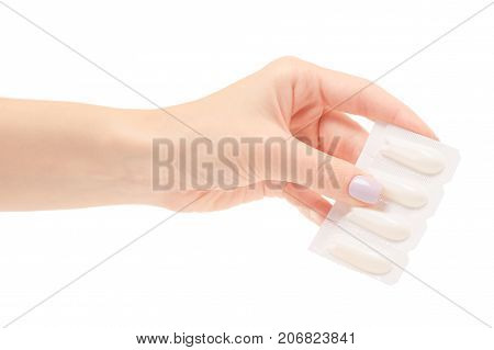 Female hand holding suppositoria medicine on white background isolation