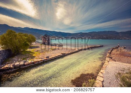 Old windmills near famous summer resort Elounda, Eastern Crete, Greece