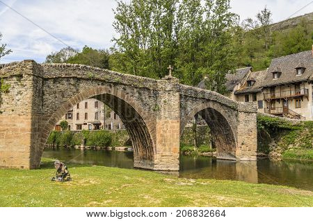 Bridge over the river Aveyron that gives name to the department in the French region of midi pyrenees at the height of the medieval village of Belcastel cataloged as one of the most beautiful villas in France.