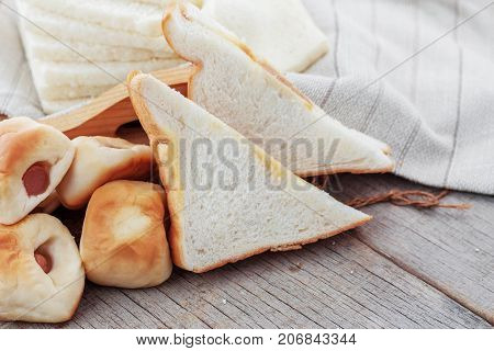Many Breads Are Laid On Wooden Boards.