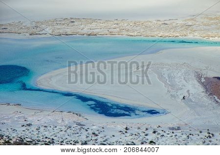 Amazing view of Balos Lagoon with magical turquoise waters, lagoons, tropical beaches of pure white sand and Gramvousa island on Crete, Greece