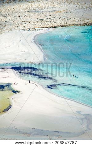 Amazing view of Balos Lagoon with magical turquoise waters, lagoons, tropical beaches of pure white sand and Gramvousa island on Crete, Greece