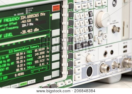 Fragment of a modern digital oscilloscope. Scientific measuring equipment. Abstract industrial background.