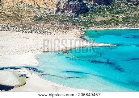Amazing view of Balos Lagoon with magical turquoise waters, lagoons, tropical beaches of pure white sand and Gramvousa island on Crete, Greece