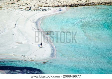 Amazing view of Balos Lagoon with magical turquoise waters, lagoons, tropical beaches of pure white sand and Gramvousa island on Crete, Greece