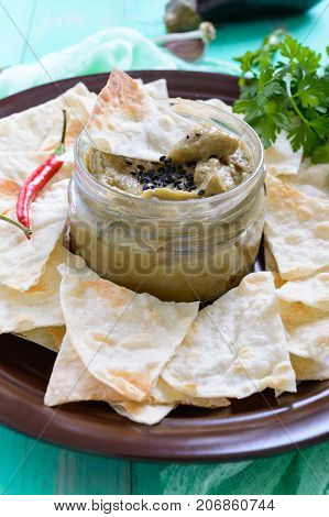 Light dietary pate from eggplant. Baba ganush is an Asian dish. Serve with thin lavash on a ceramic bowl.