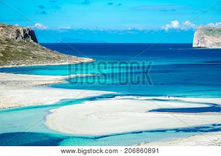 Amazing view of Balos Lagoon with magical turquoise waters, lagoons, tropical beaches of pure white sand and Gramvousa island on Crete, Greece