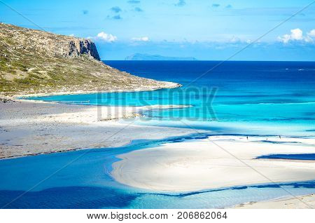Amazing view of Balos Lagoon with magical turquoise waters, lagoons, tropical beaches of pure white sand and Gramvousa island on Crete, Greece