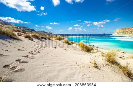 Amazing view of Balos Lagoon with magical turquoise waters, lagoons, tropical beaches of pure white sand and Gramvousa island on Crete, Greece