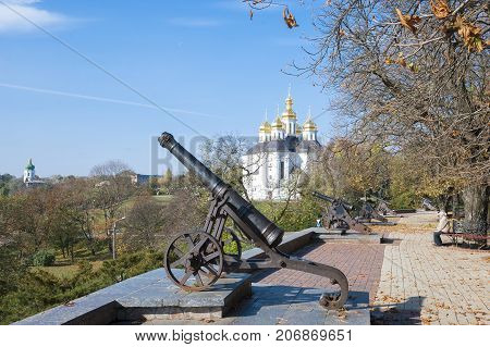 Chernigov,Ukraine, October 19, 2011: Ancient cannons and a church on the rampart of the city of Chernigov, Ukraine