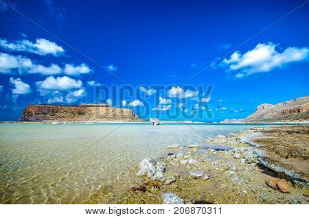 Amazing view of Balos Lagoon with magical turquoise waters, lagoons, tropical beaches of pure white sand and Gramvousa island on Crete, Greece