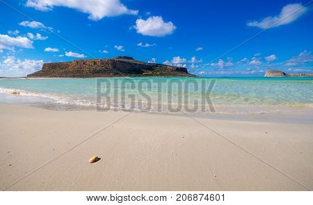 Amazing view of Balos Lagoon with magical turquoise waters, lagoons, tropical beaches of pure white sand and Gramvousa island on Crete, Greece