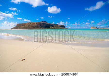 Amazing view of Balos Lagoon with magical turquoise waters, lagoons, tropical beaches of pure white sand and Gramvousa island on Crete, Greece