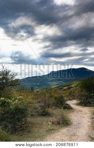 Dark Gray Clouds Over Mountan Valley In Crimea