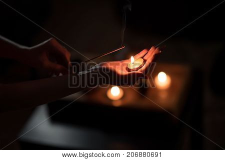 Tea ceremony with candles in the evening