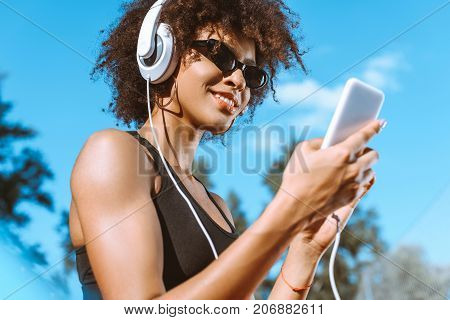 Sportive African-american Woman In Headphones