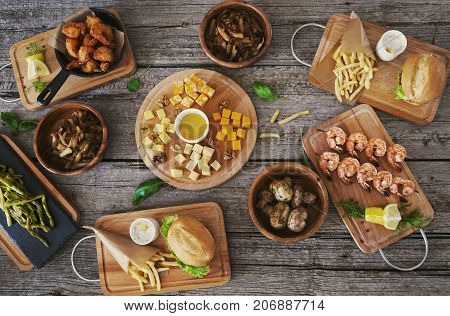 Top view of rustick wooden table with food and snack