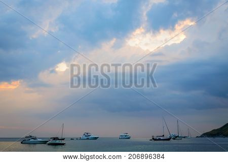 The Small Speedboat Is Mooring In The Wavy Sea Near The Shore With The Background Of The Sea Horizon
