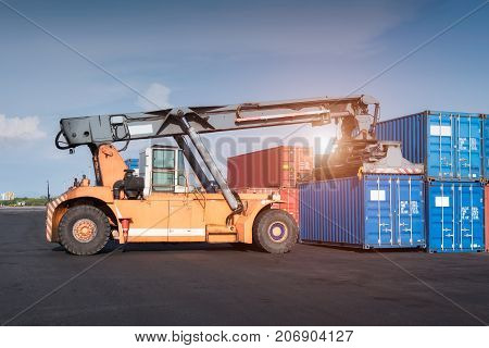 Forklift Truck Lifting Cargo Containers In Shipping