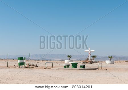 A picnic spot with memorial cross next to the B2-road between Arandis and Usakos in the Namib Desert of Namibia