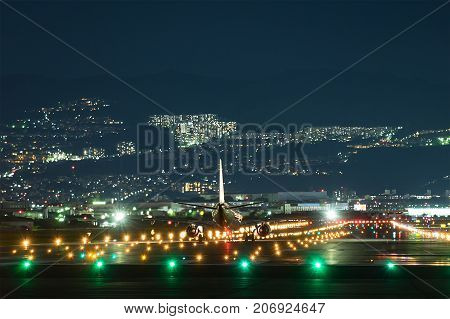 Airplane taking off from the airpot in the night.