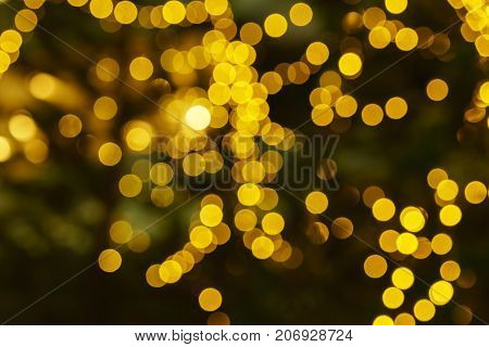 Defocused lights abstract golden nonagon bokeh background