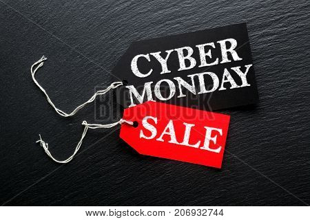 Cyber Monday Sale tags on dark background