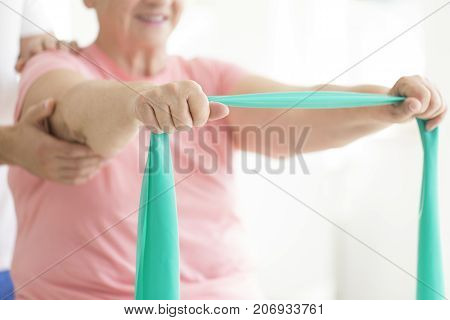 Senior Woman Holding Teal Scarf