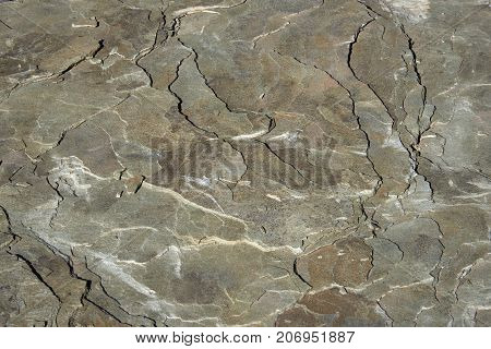The surface of a stone plate with a layered structure. Texture background