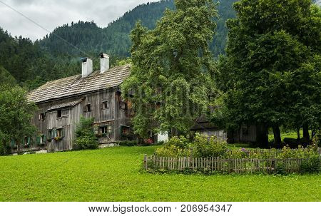 Old Farmhouse In Th Alps On A Cloudy Day