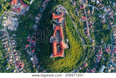 Aerial view of the Majestic Fortress - Palanok Castle towering above the city of Mukacheve, Ukraine. Top view, from above