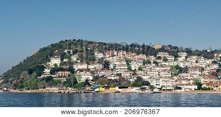 View of Kinaliada island from the sea with summer houses. One of four islands named Princes Islands in the Sea of Marmara near Istanbul