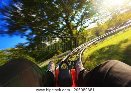 Very fast summer toboggan-run from inside in nature