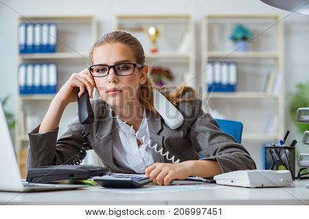Young businesswoman accountant working in the office