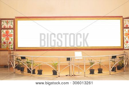A Big White Bill Board On Wall At Museam