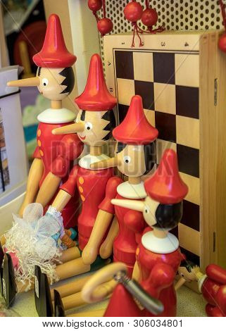 Sorrento, Italy - June 12, 2017: Painted Wooden Marionette Dolls Of The Figure Of Pinocchio  In A So