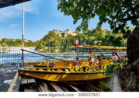 Rhine, Switzerland - September 19, 2018: Tourists Sitting In The Boat On The River Rhine Near The Rh