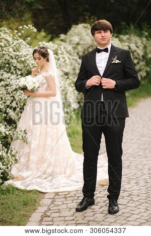 Handsome Groom Staind In Front Of Beutiful Bride