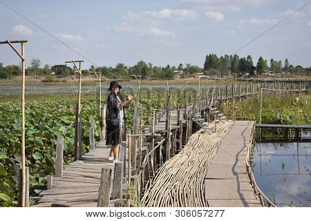 Travelers Thai Women People Travel Visit And Posing Portrait For Take Photo On Kae Dam Long Wood Bri