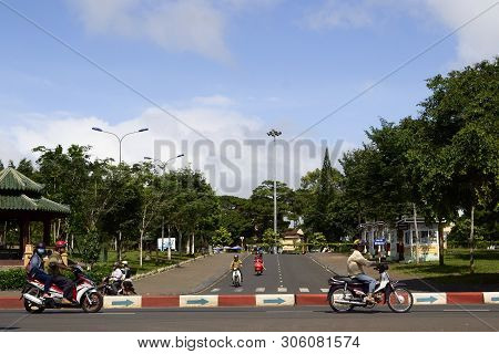 Pleiku, Vietnam - September, 2015: Motorcycles On The Road With No Cars. Arrows Showing Traffic Dire
